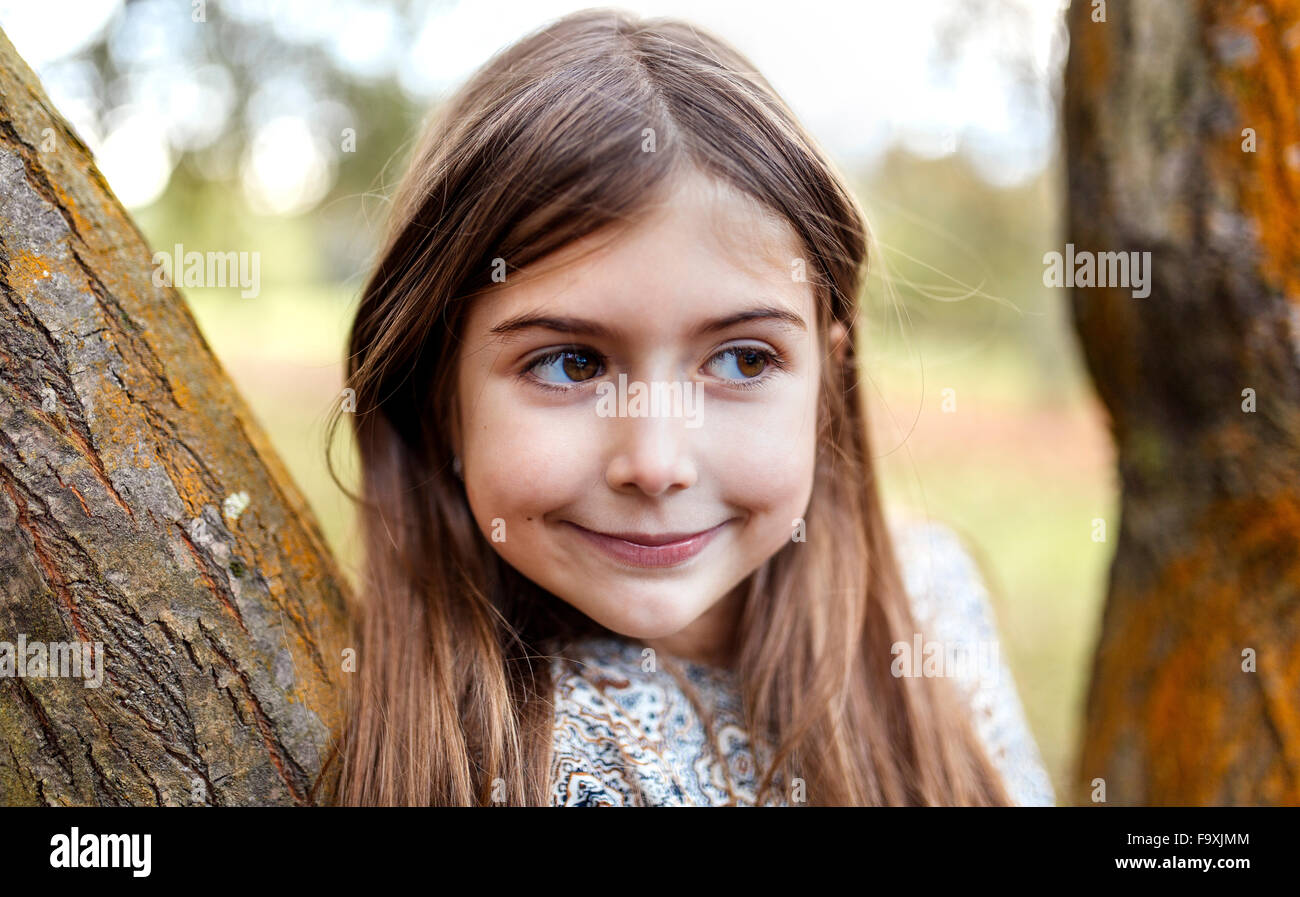 Portrait of smiling girl in nature Stock Photo - Alamy