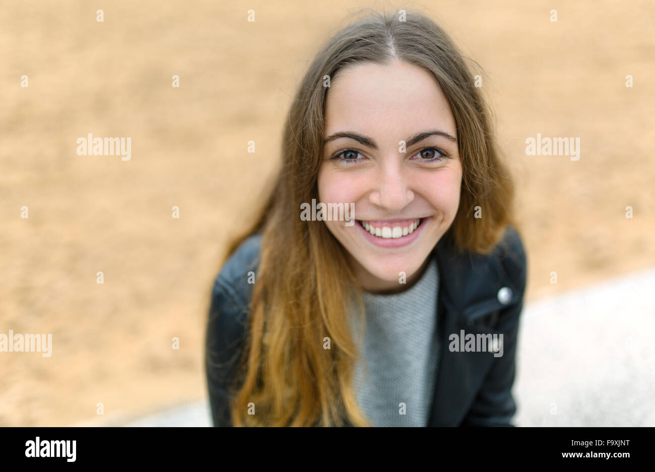 Portrait of smiling teenage girl outdoors Stock Photo - Alamy