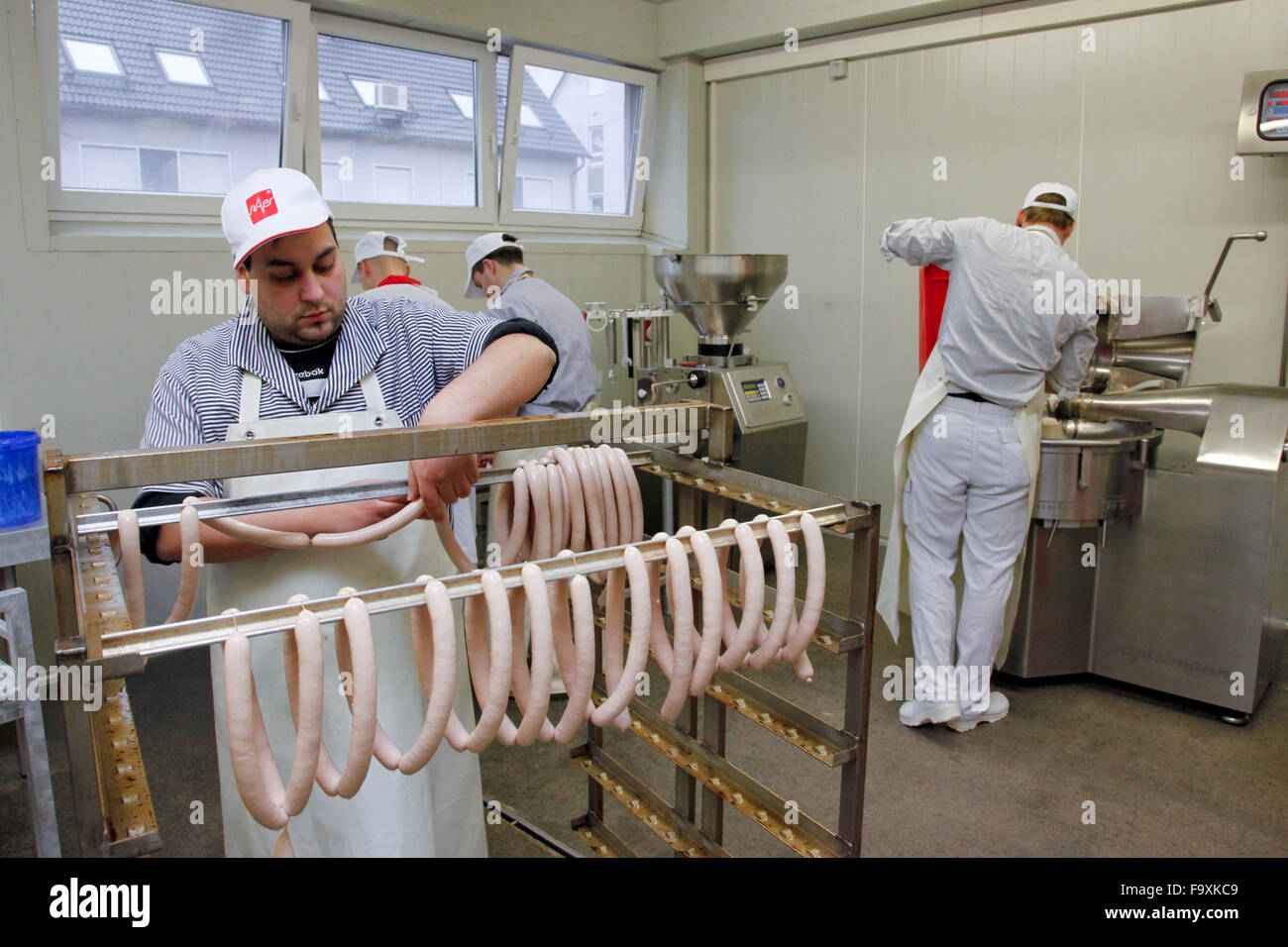 Butcher making sausages Stock Photo Alamy