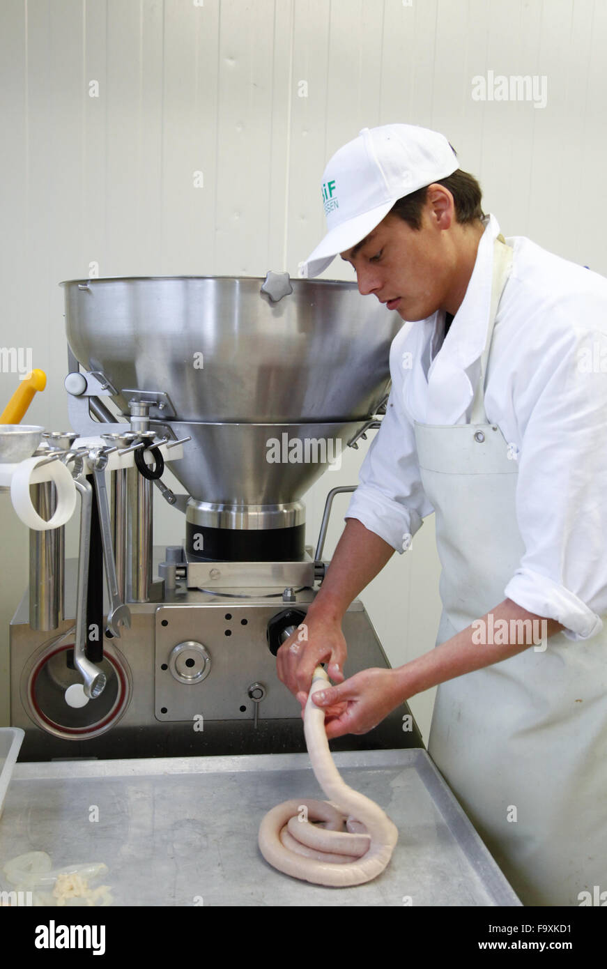 Butcher making sausages Stock Photo Alamy