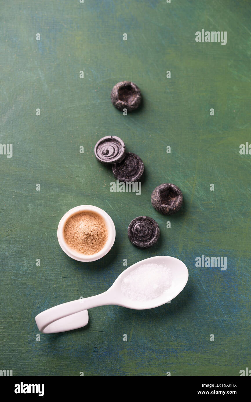 Licorice candies and liquorice root powder hires stock photography and