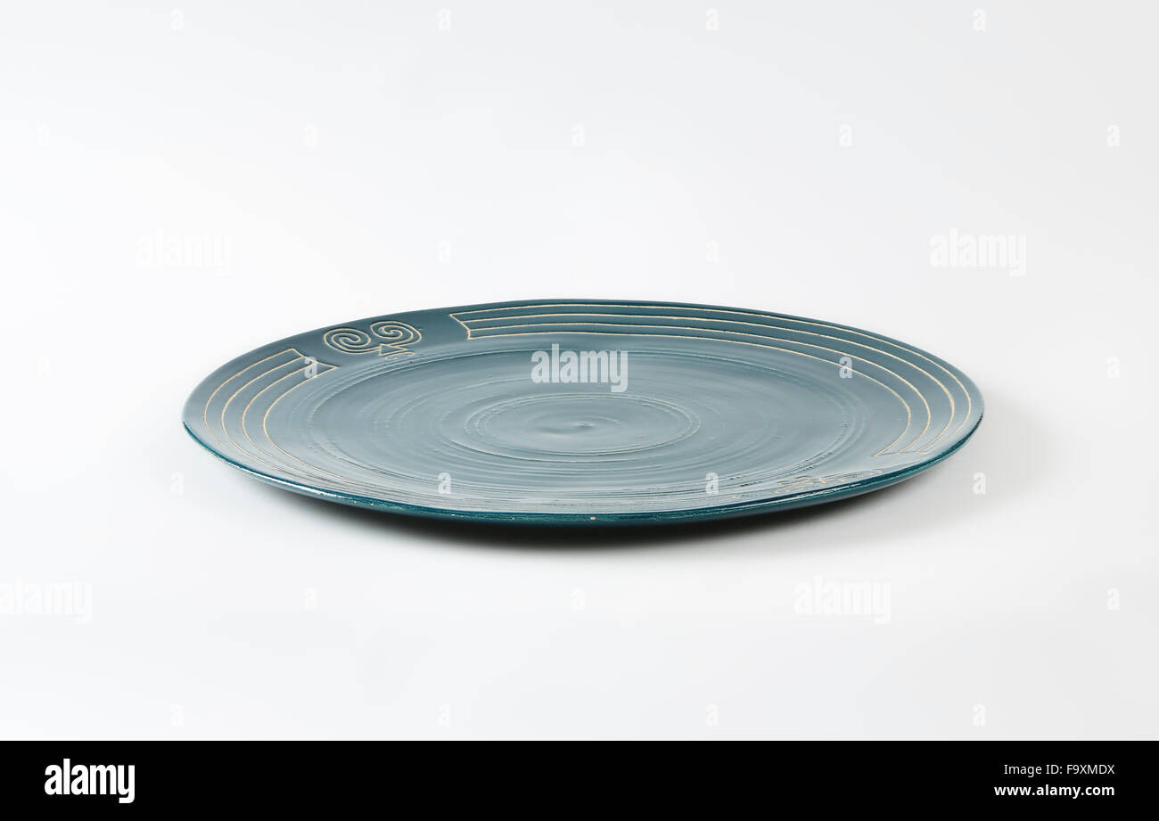 Handcrafted ceramic plate with engraved symbols Stock Photo Alamy