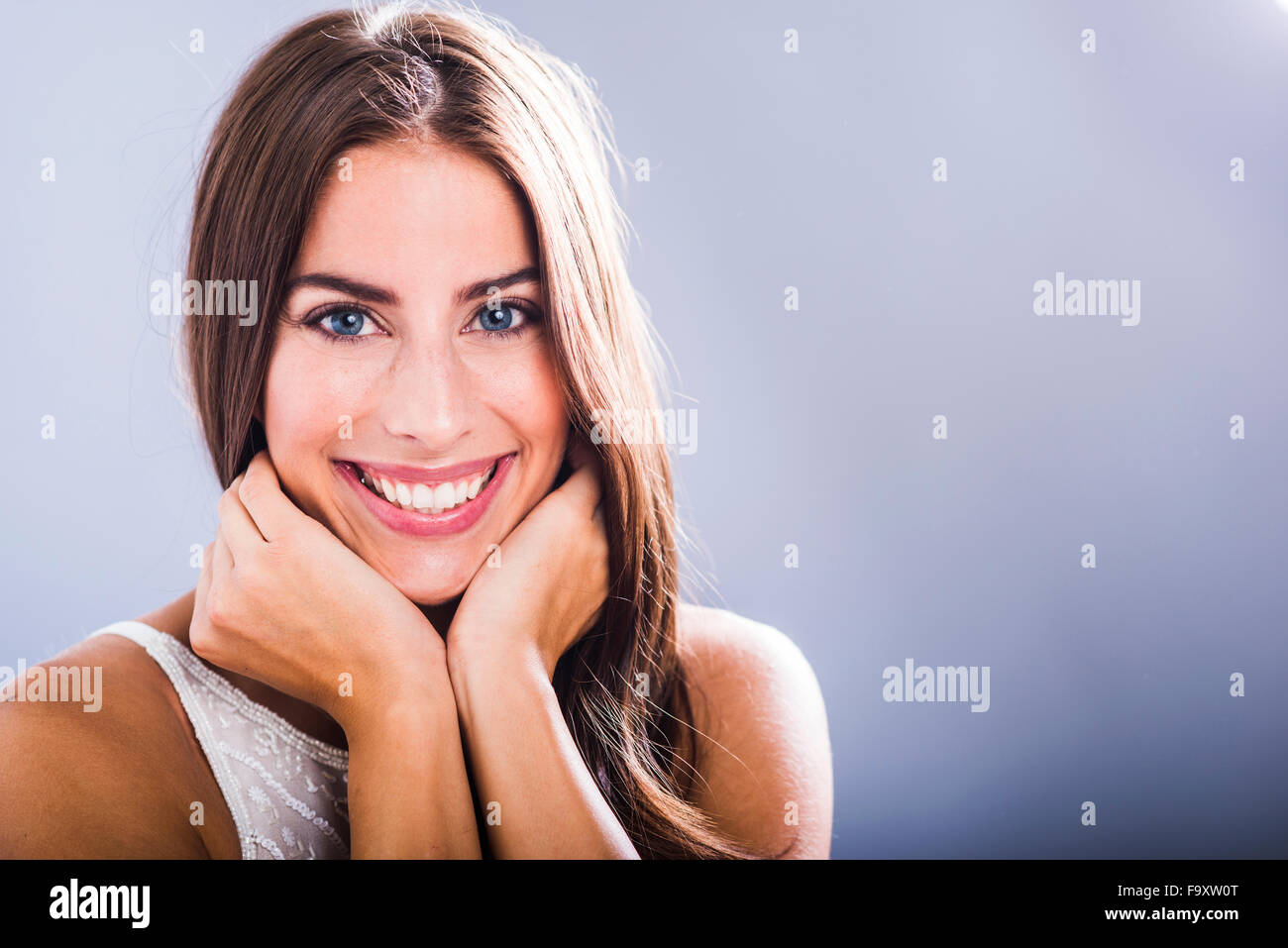 Portrait of smiling brunette woman Stock Photo