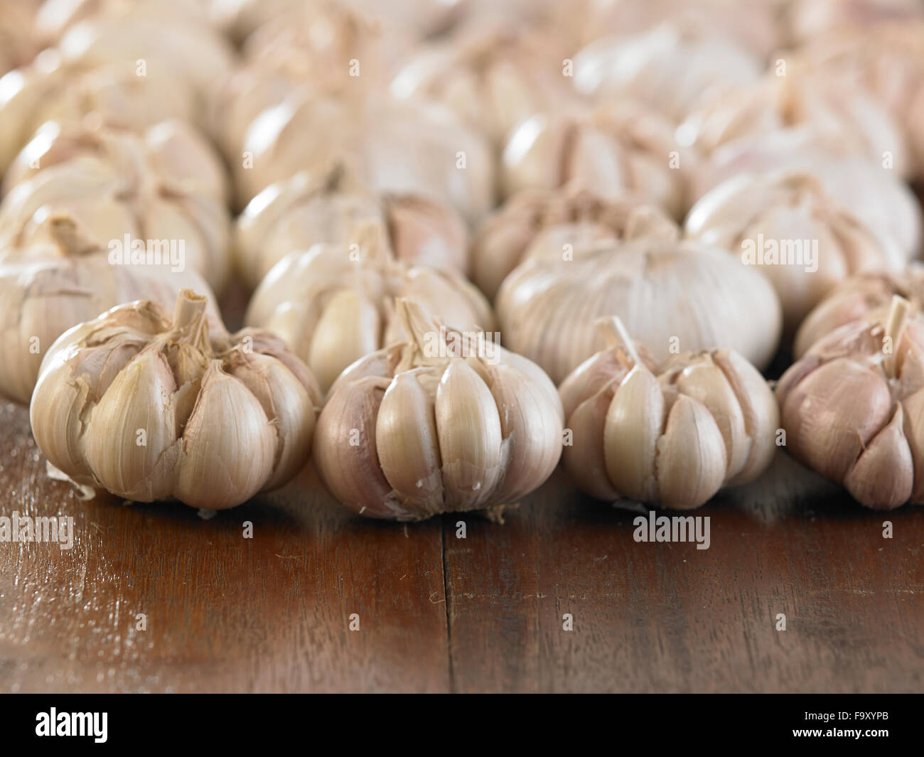 garlic on the wooden table Stock Photo - Alamy