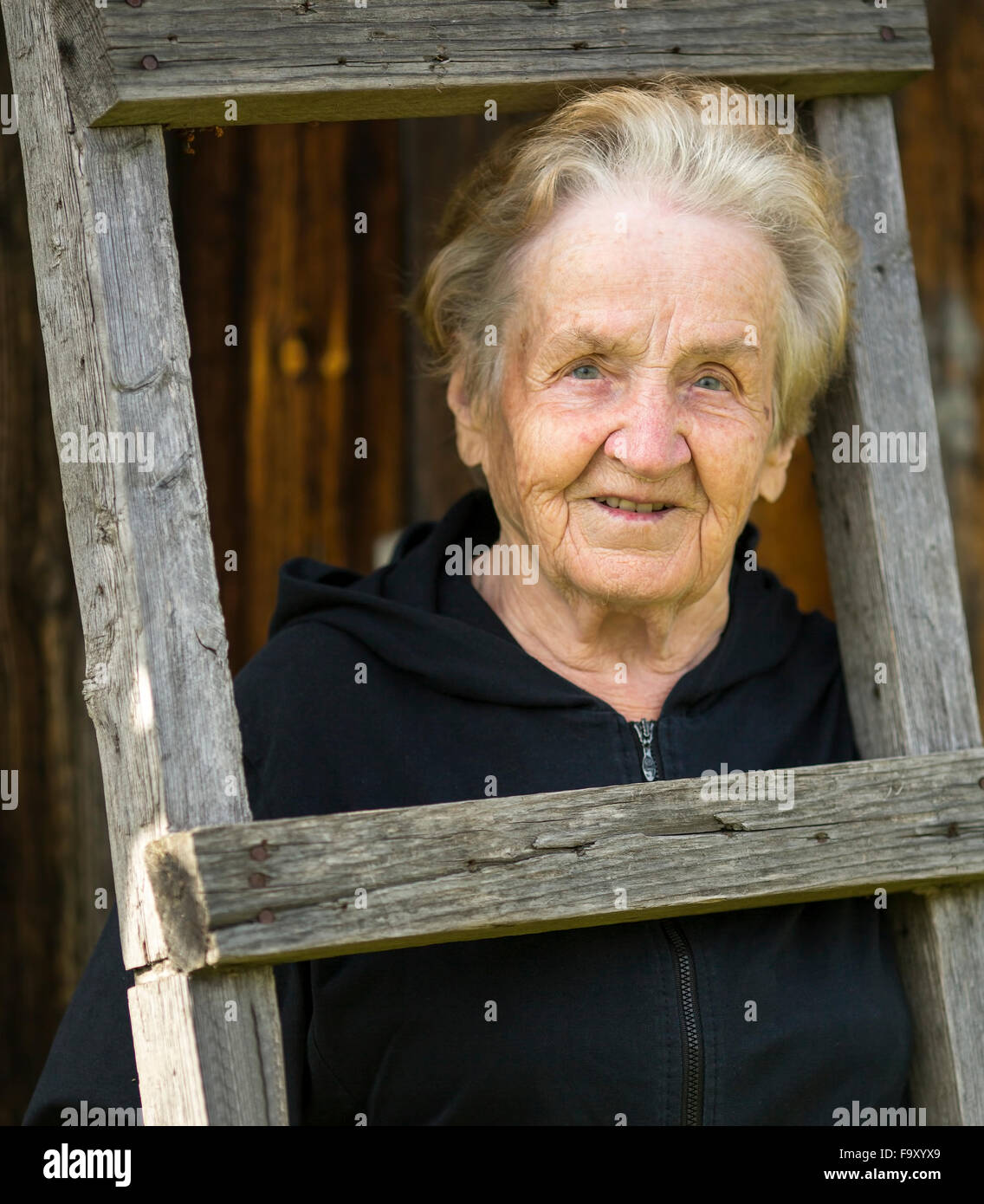 Portrait of an elderly woman in the village. Stock Photo