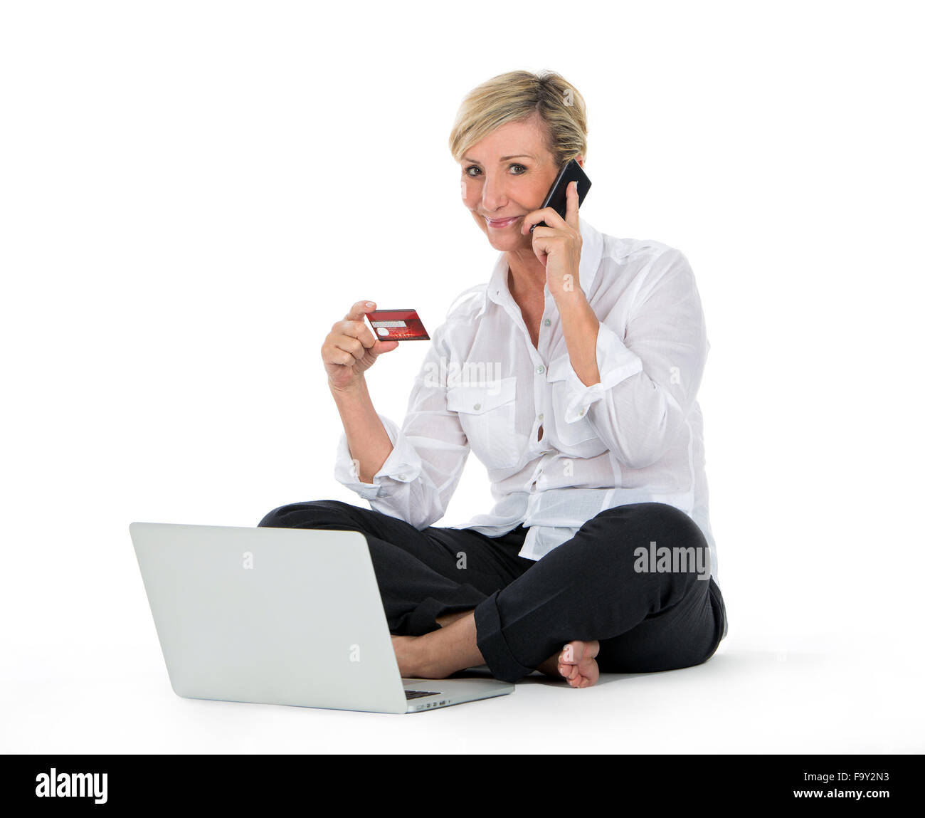 woman doing shopping on line with credit card and portable computer Stock Photo
