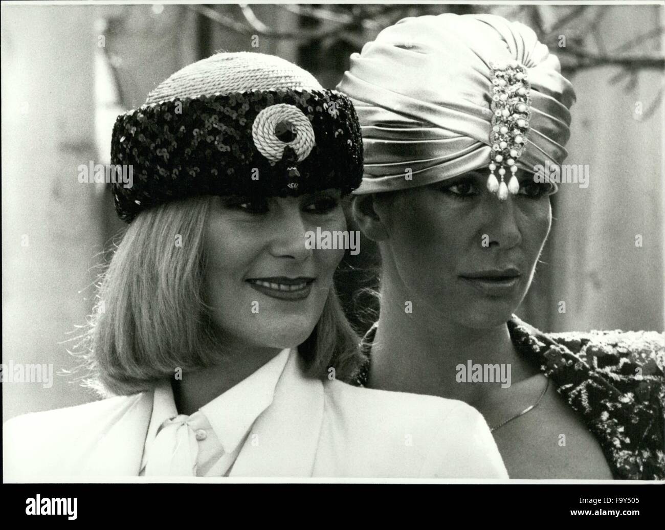 1974 - New Fashion Of Hats Shown In Munich/West Germany. These elegant hats.glinting and glittering, are calling attention to their female wearers. They can wear them in the evening. Here are two models out of the new collection of fashion of hats introduced by the ''working group hat'' in Munich now. At the left, there is a cap bordered with cords and pailletts, and at the right, there is a turban, looking like one of a maharajah and made of white satin-silk. It's also trimed with pailletts and pearls. © Keystone Pictures USA/ZUMAPRESS.com/Alamy Live News Stock Photo