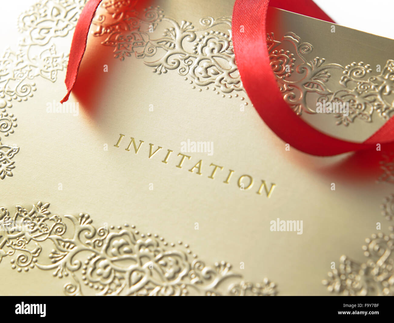 golden invitation card with ribbon Stock Photo - Alamy