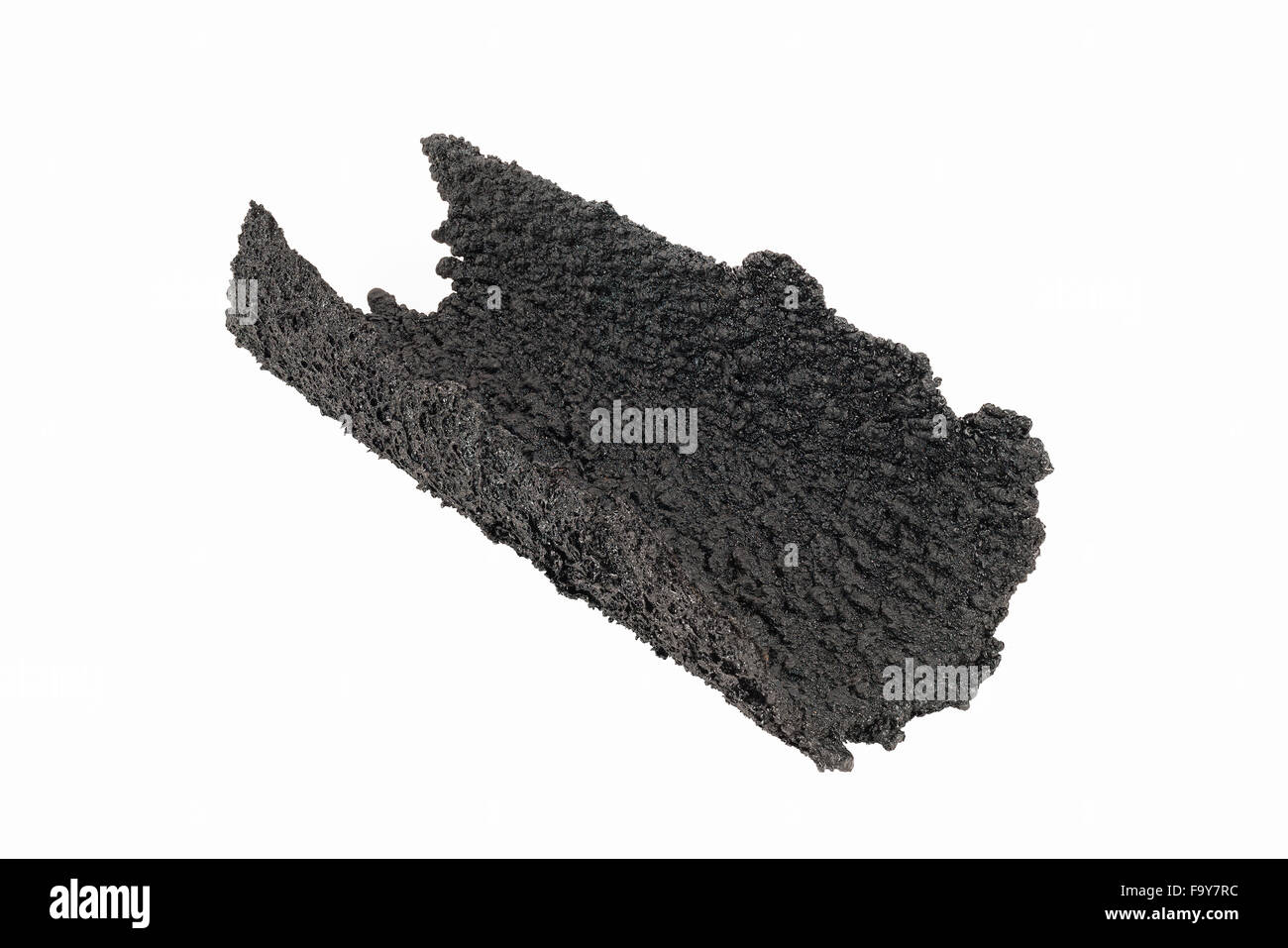Dangerous accumulation of Creosote removed from a Wood Stove Chimney Pipe. Stock Photo