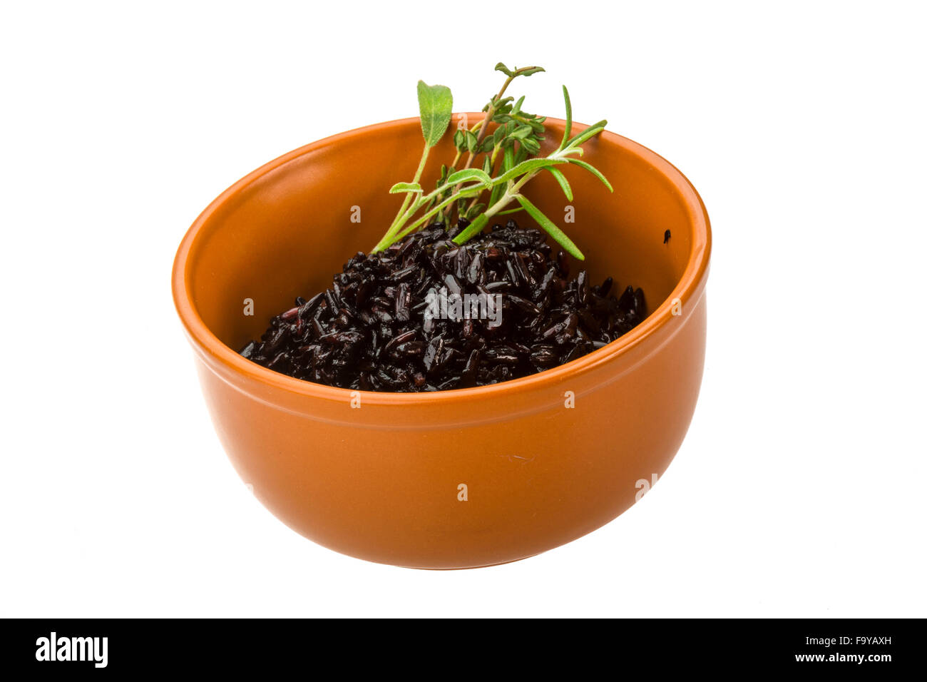 Black boiled rice with thyme Stock Photo