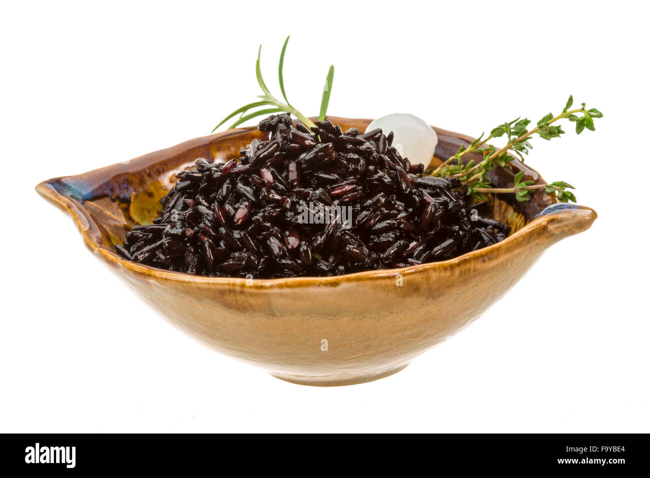 Black boiled rice with thyme Stock Photo