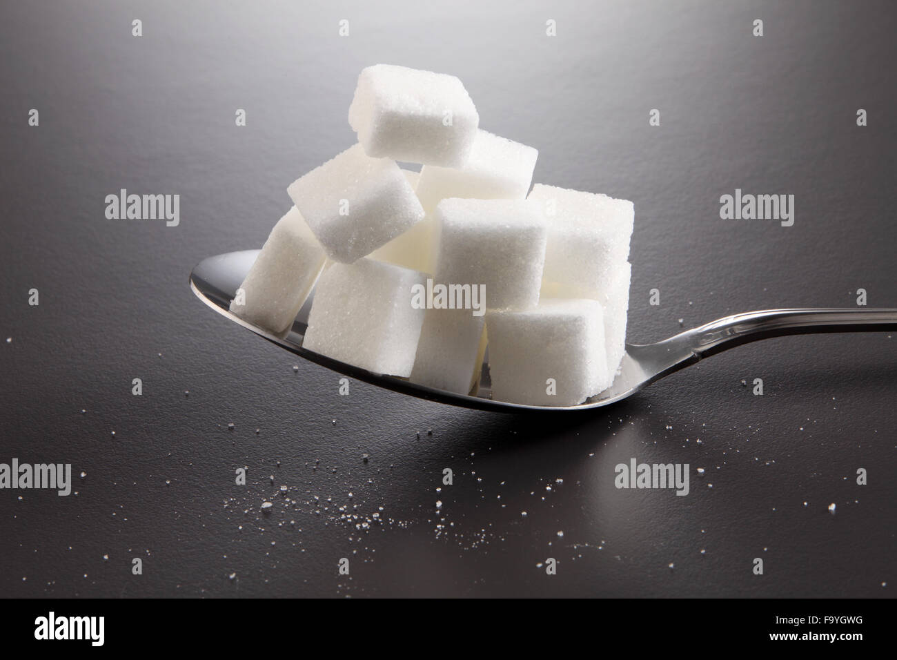 big or super size spoon with pile of cube white sugar Stock Photo - Alamy