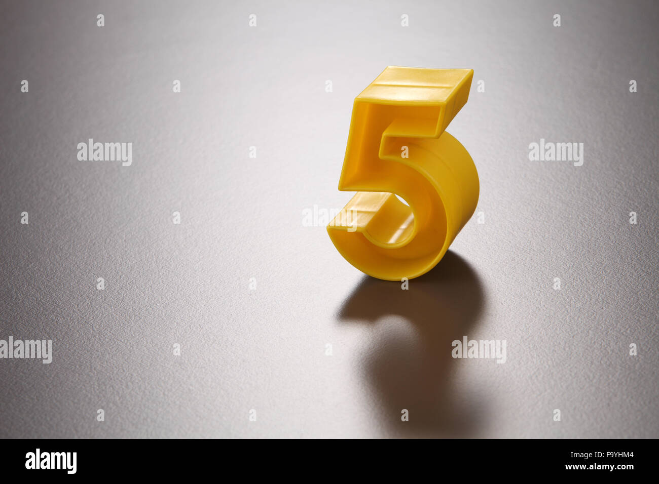 number five on the gray background Stock Photo