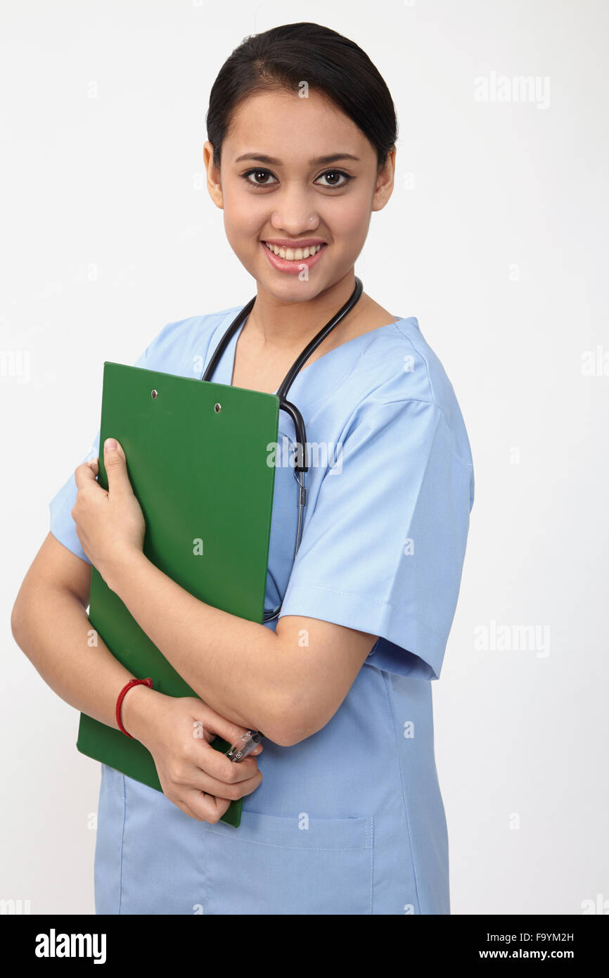 nurse doctor woman smile with stethoscope hold clipboard, wear blue