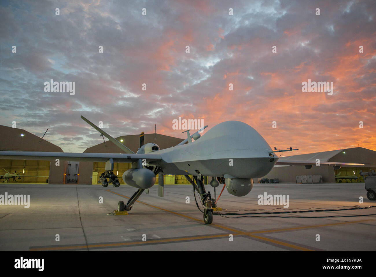 A U.S. Air Force extended range MQ-9 Reaper drone with the 62nd Expeditionary Reconnaissance Squadron on the ramp at Kandahar Airfield December 6, 2015 in Kandahar, Afghanistan. The modification allows for up to 20 to 40 percent additional flight time. Stock Photo