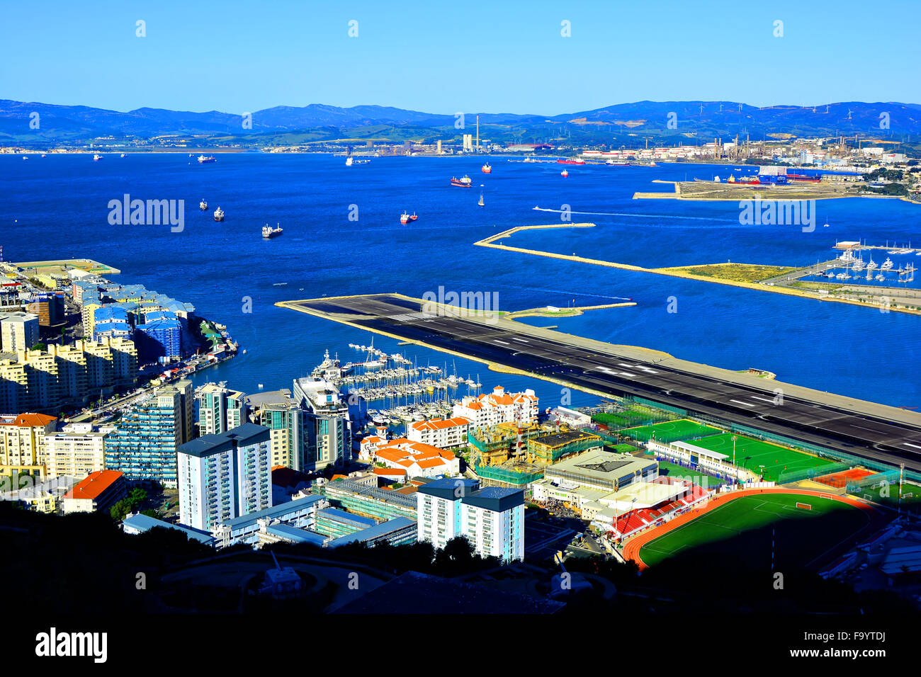 Gibraltar airport runway harbour flats sports pitches and marina looking towards Bay of Gibraltar Stock Photo