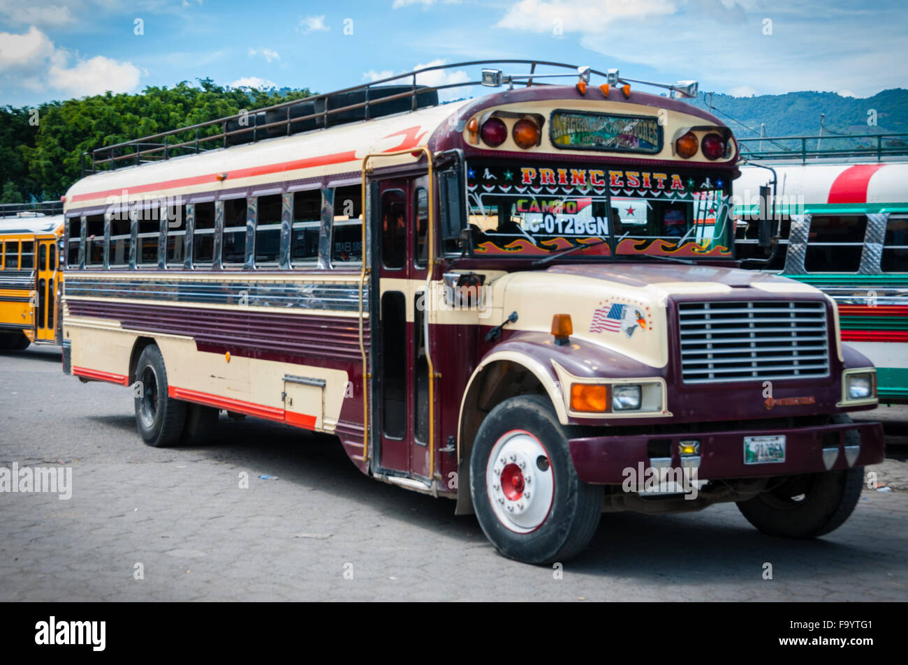 Maroon and Beige Jeepney bus truck Parked on The Side Stock Photo