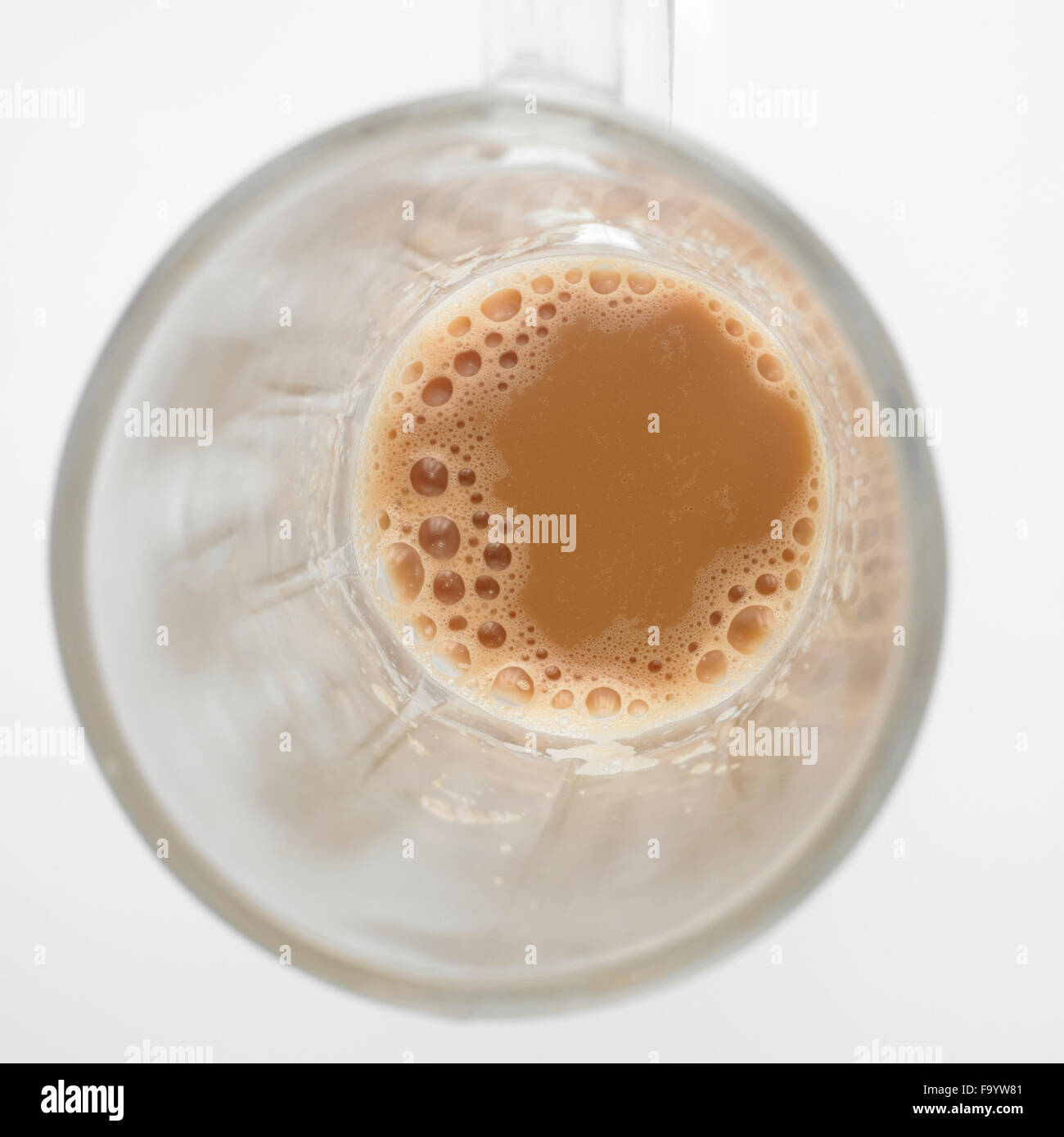 Top view of lnearly empth glass with little Tea with milk or Teh Tarik in Malaysia Stock Photo