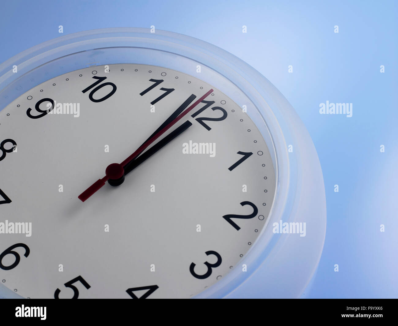 Time shows One Minute to 12 Stock Photo - Alamy