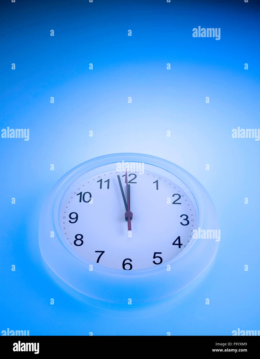 Time shows One Minute to 12 Stock Photo - Alamy
