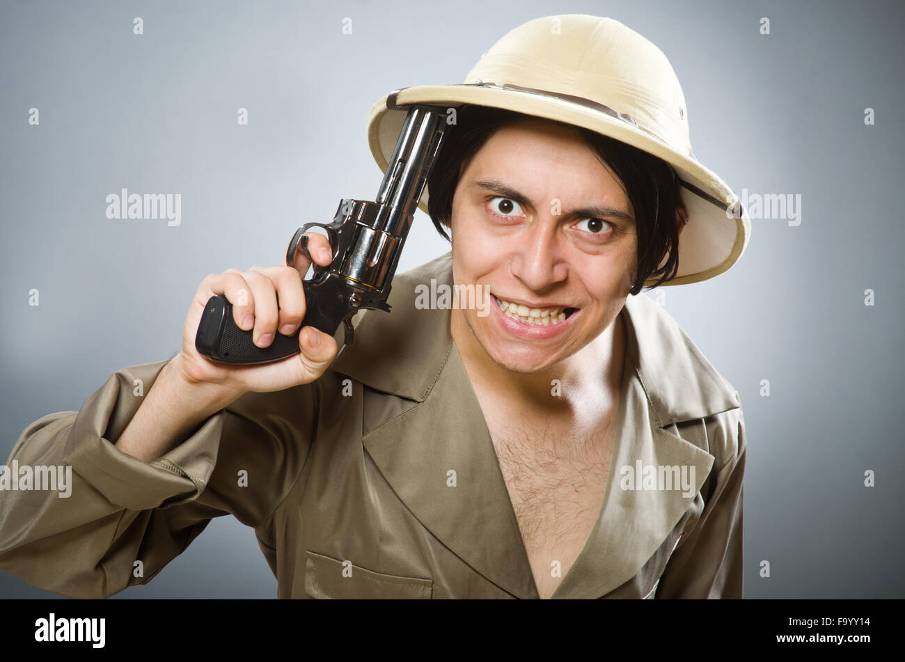 Man wearing safari hat in funny concept Stock Photo - Alamy