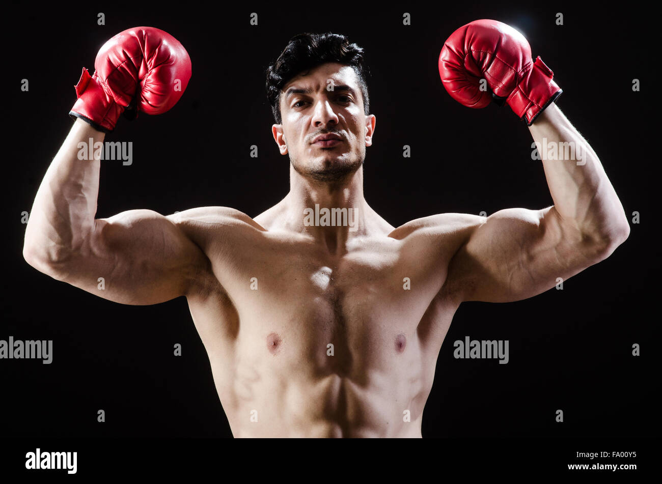 Muscular man in boxing concept Stock Photo - Alamy