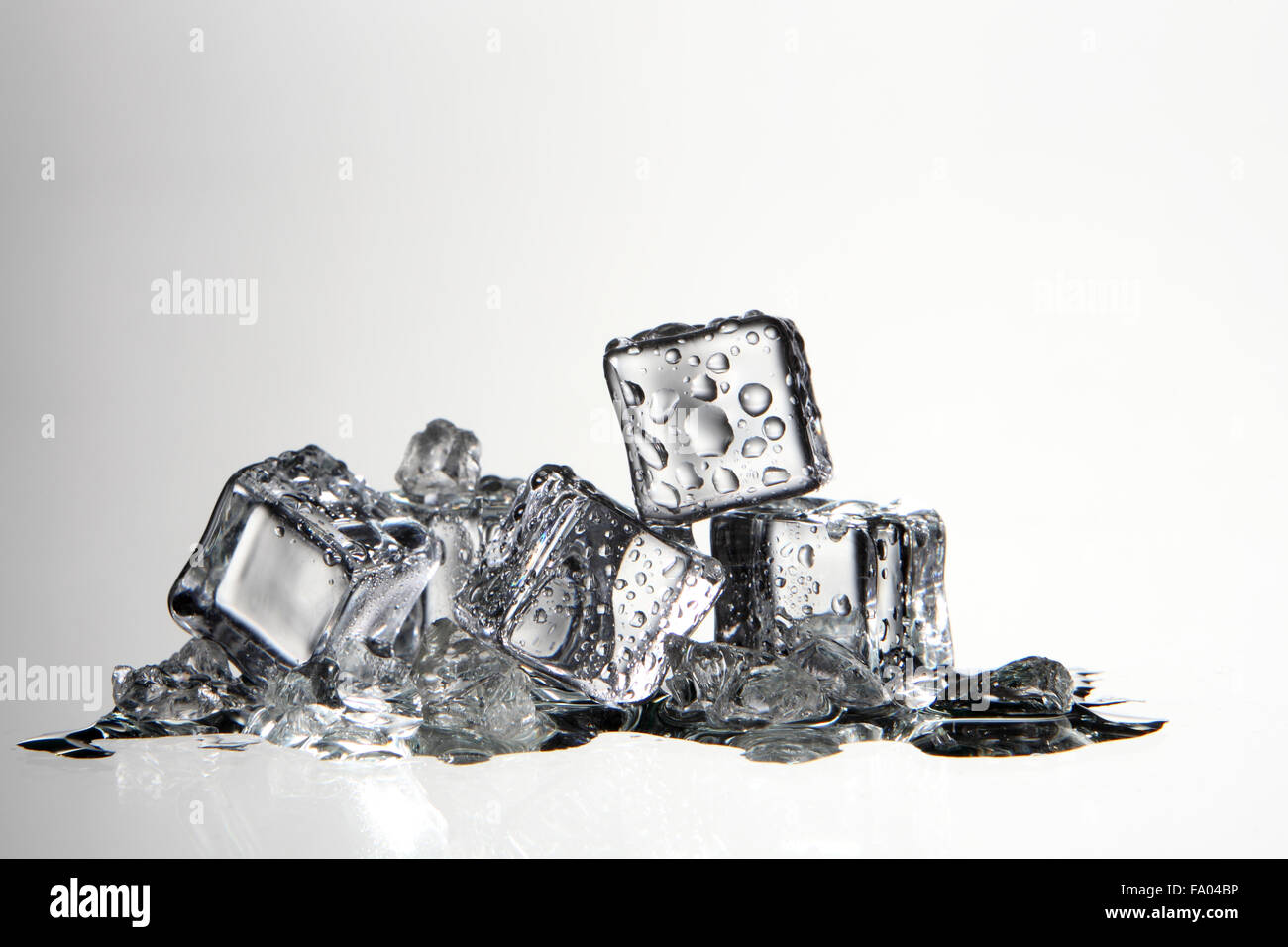 ice cube with water drop on the white background Stock Photo - Alamy