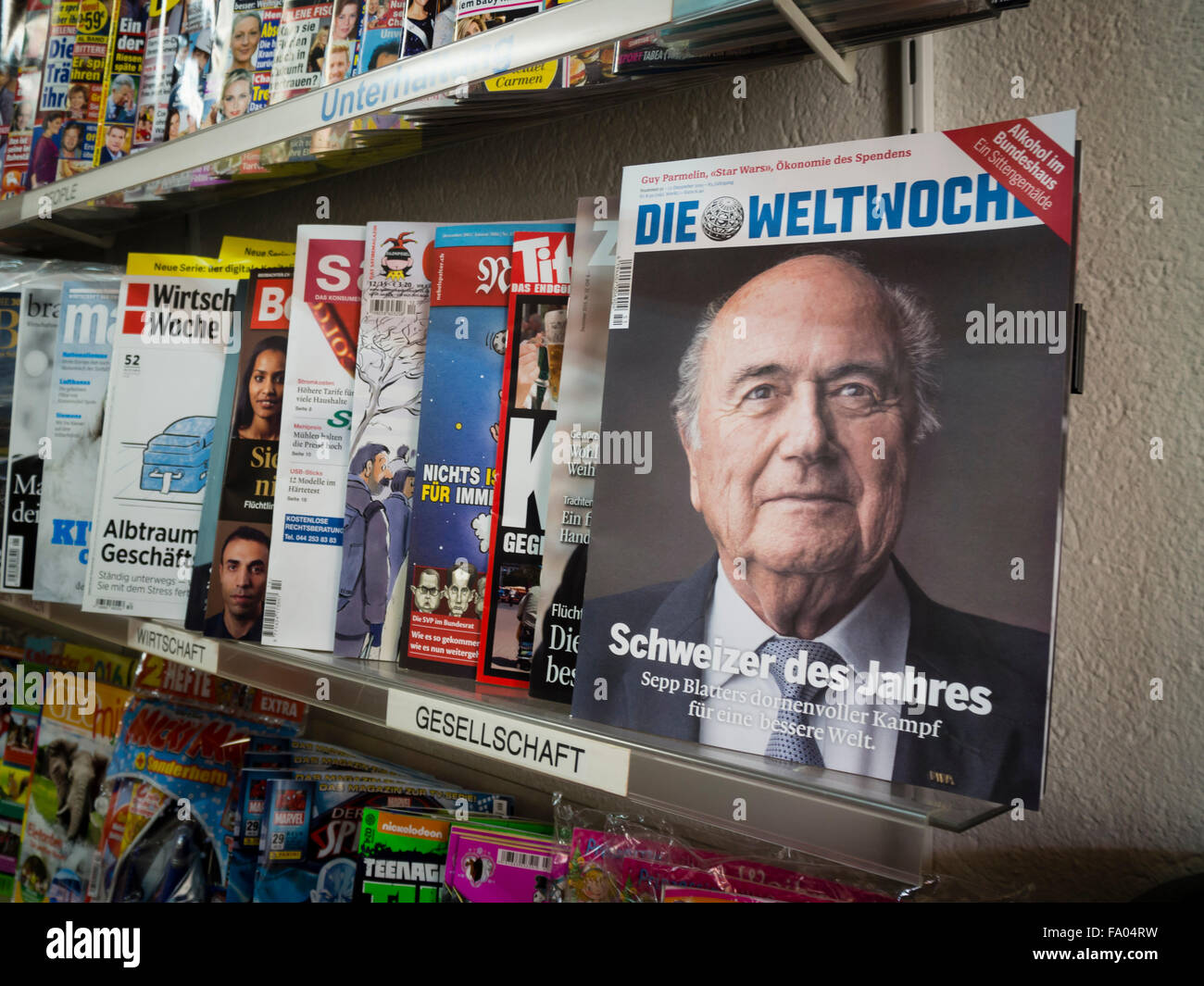 The portrait of suspended FIFA boss Sepp Blatter is featured on the cover of Swiss 'Weltwoche' magazine that is put up for sale on the shelf of a Zurich newsstand. The conservative weekly magazine named Blatter 'Swiss person of the year' for his 'impressive achievements'. Stock Photo