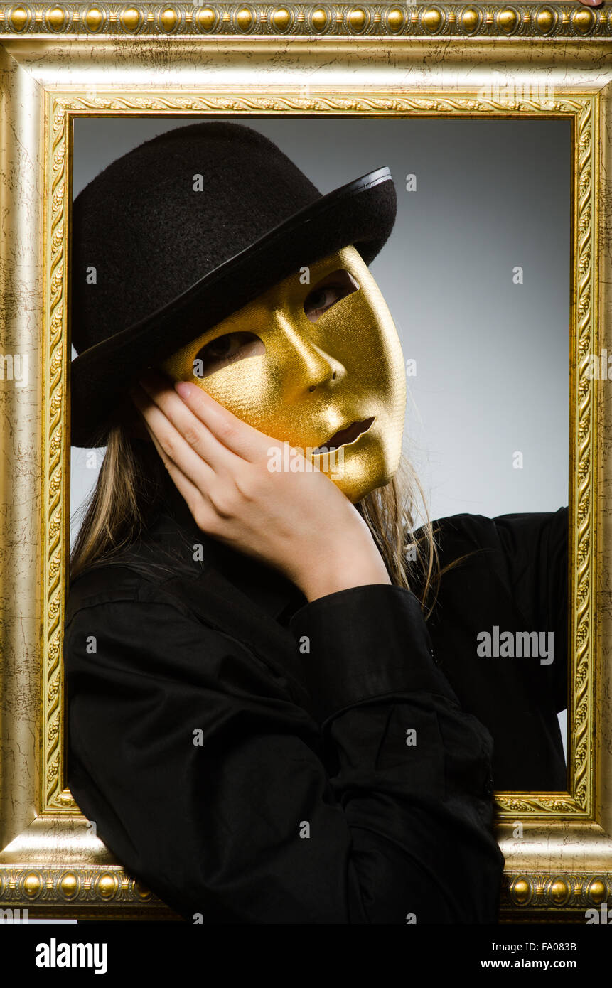 Woman with mask in funny concept Stock Photo - Alamy