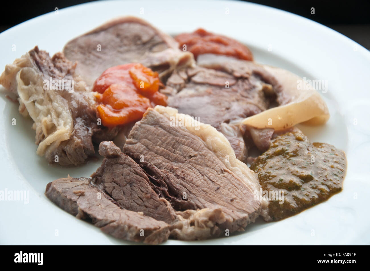 Boiled meat typical Piedmontese dish with calf's head, beef tongue, beef biancostato,italy Stock Photo