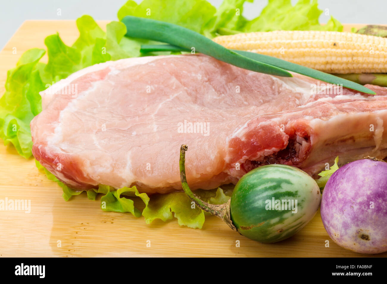 Raw tbone steak with asparagus and eggplant Stock Photo Alamy