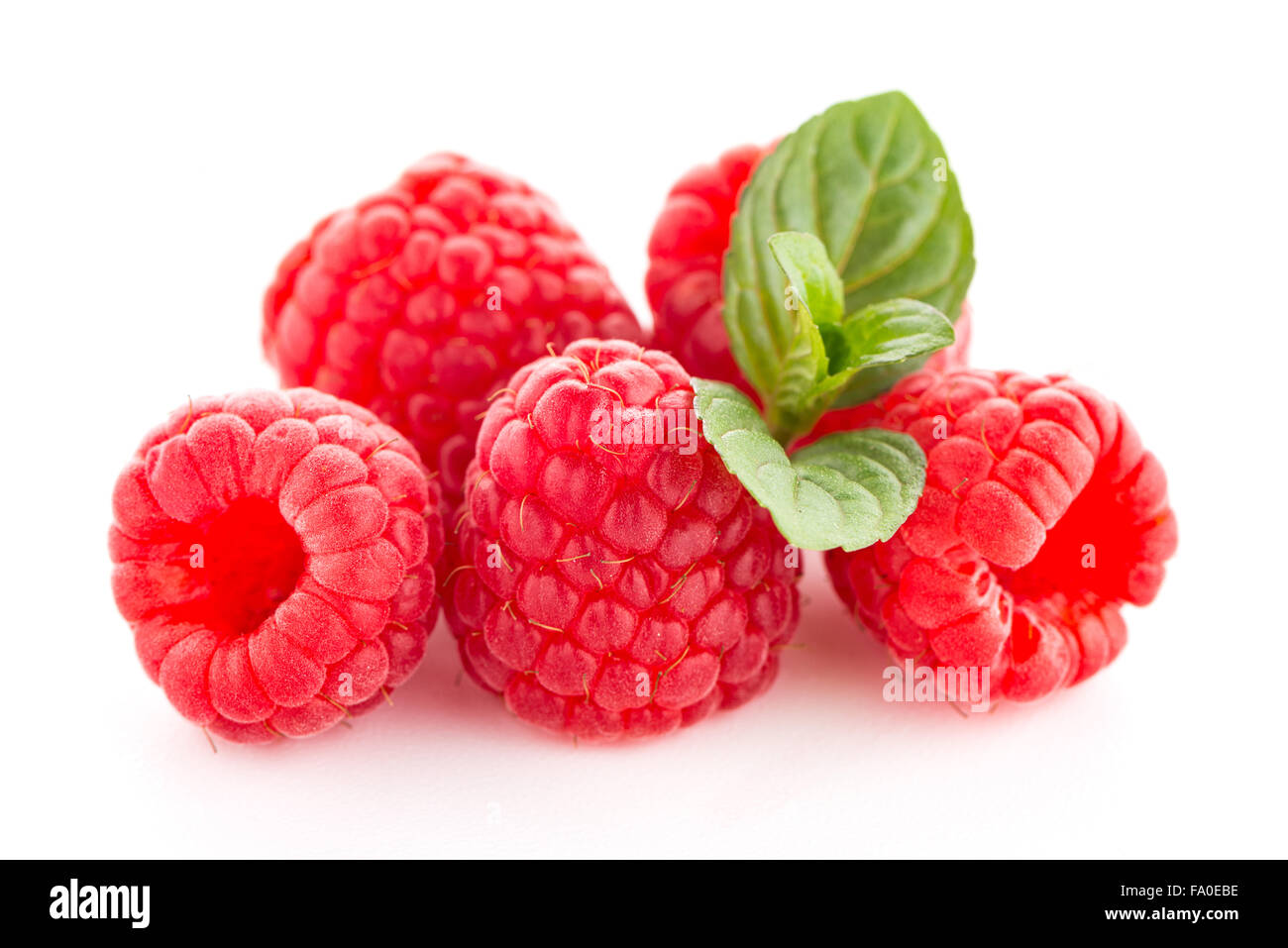 Raspberries with leaves isolated on white background Stock Photo - Alamy