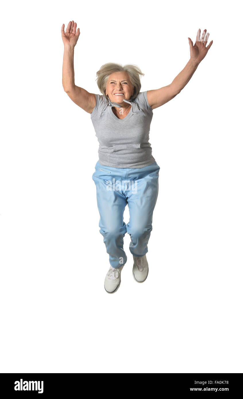 Senior woman jumping Stock Photo
