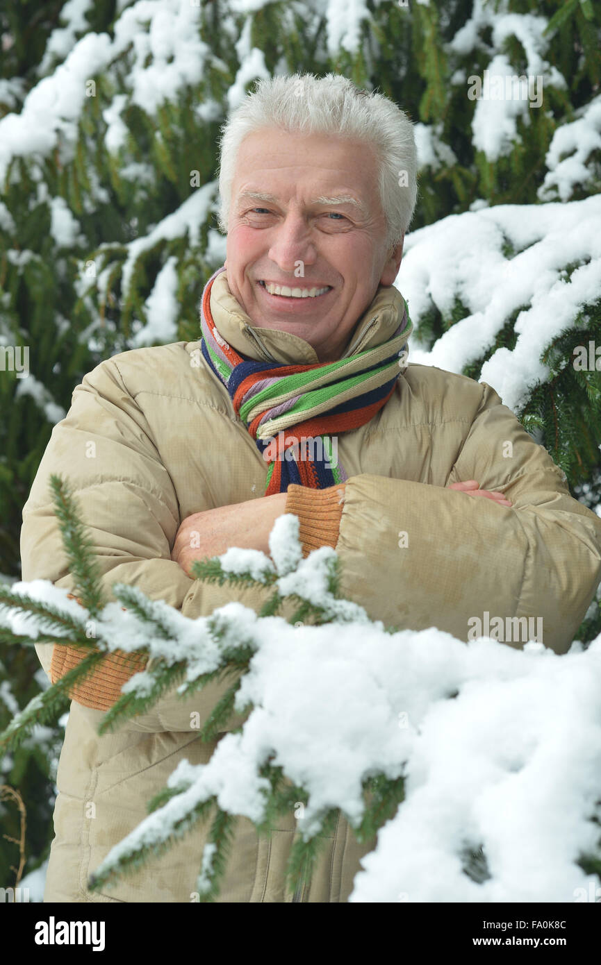 Senior man standing in winter Stock Photo - Alamy