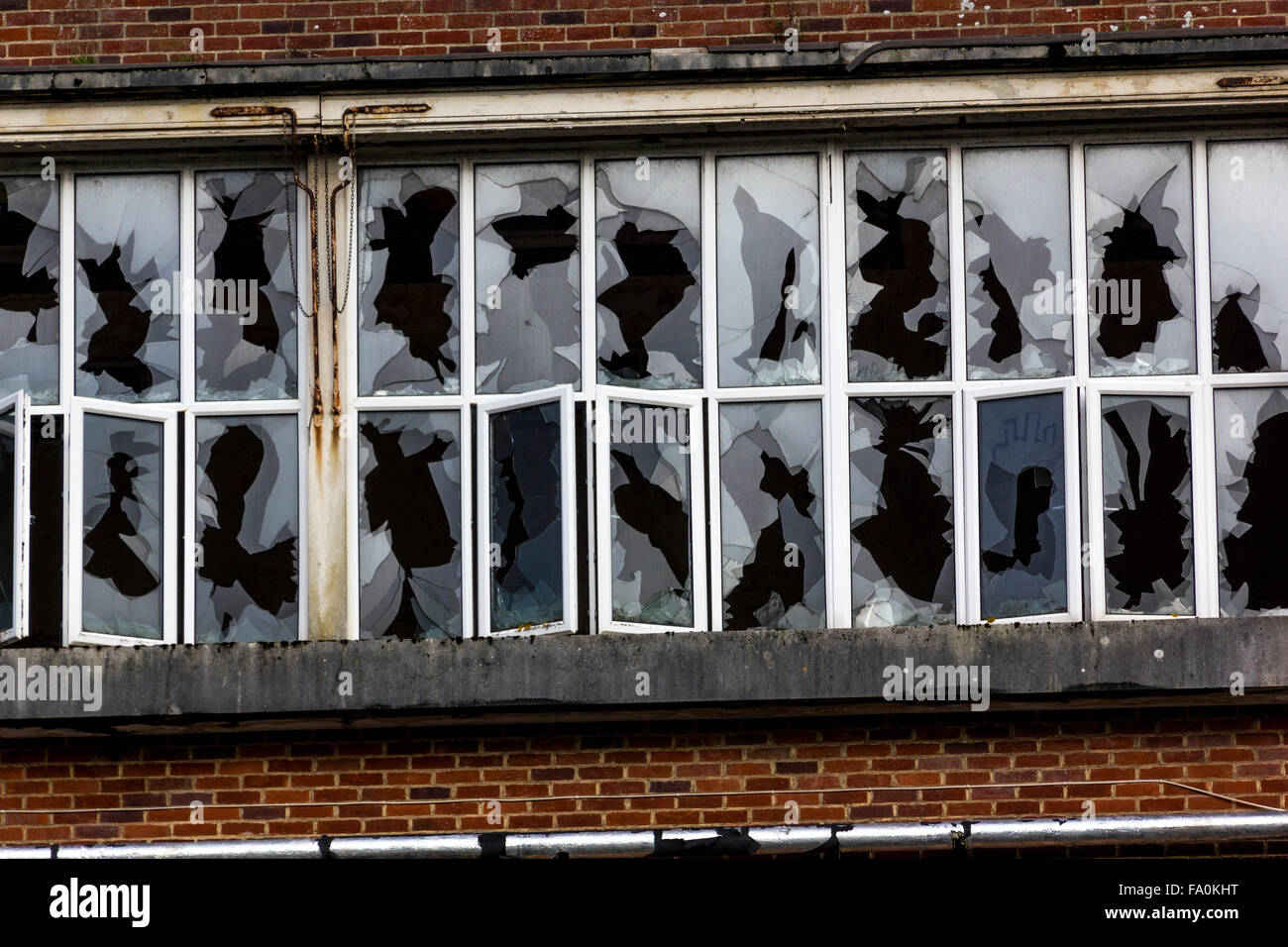 Series of Smashed Windows in the Derelict Unigate Factory, Great Torrington, Devon, England. Stock Photo