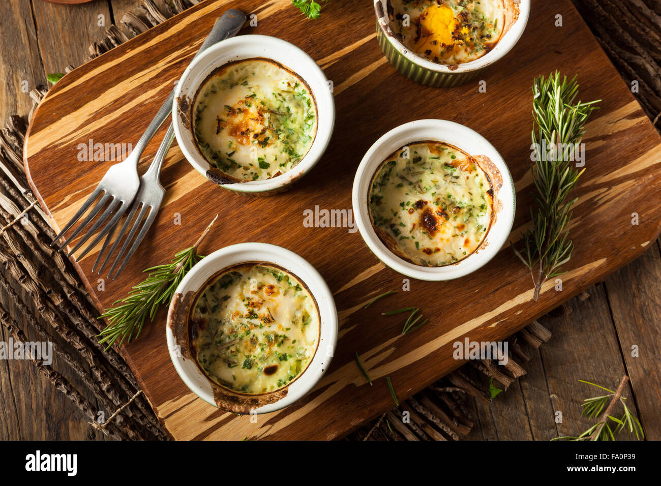 Cream Egg Bake in Ramekin with Fresh Herbs Stock Photo Alamy