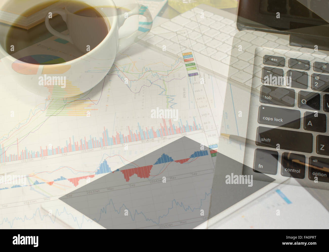 paper chart and computer on table Stock Photo - Alamy