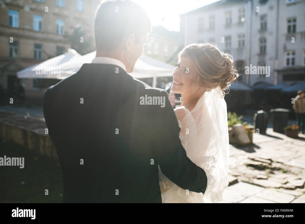 bride and groom posing on the streets Stock Photo - Alamy