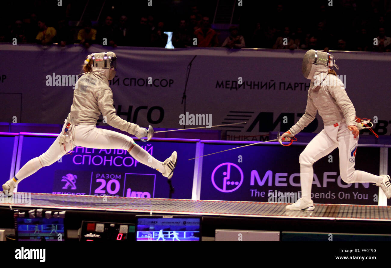 KYIV, UKRAINE - APRIL 13, 2012: Olga Kharlan of Ukraine (L) fights against Ekaterina Dyachenko of Russia during Womens Sabre Team final match of the World Fencing Championships Stock Photo