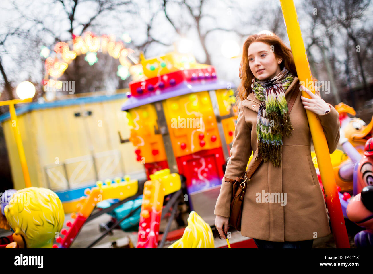 Young couple in the amusement park Stock Photo - Alamy