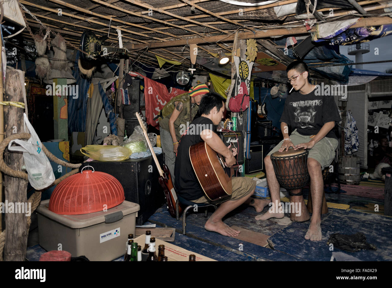 Jam session musicians in a beach side hut. Thailand S. E. Asia Stock Photo