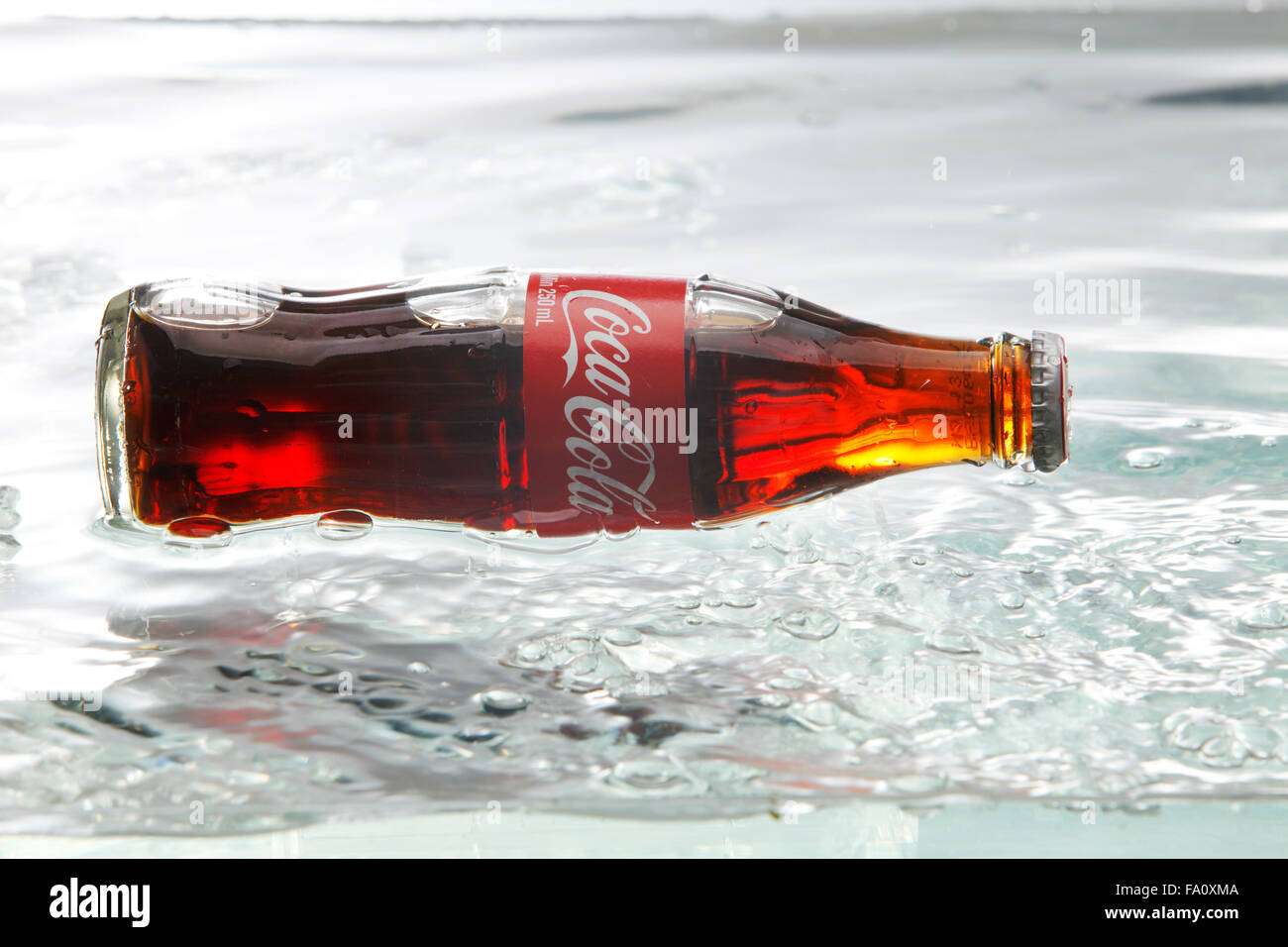 kuala Lumpur,Malaysia 16th April 2015,Editorial photo of Classic Coca-Cola Bottle with water splash Stock Photo