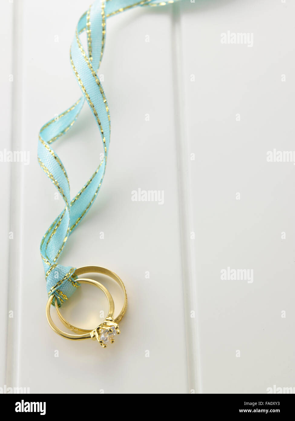 Top view Wedding rings connected with green ribbon Stock Photo Alamy