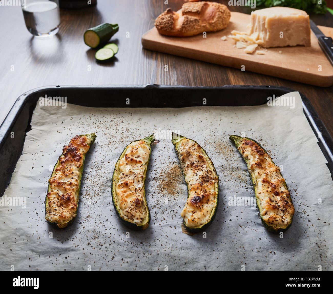 zucchini with ricotta cheese baked on baking sheet Stock Photo