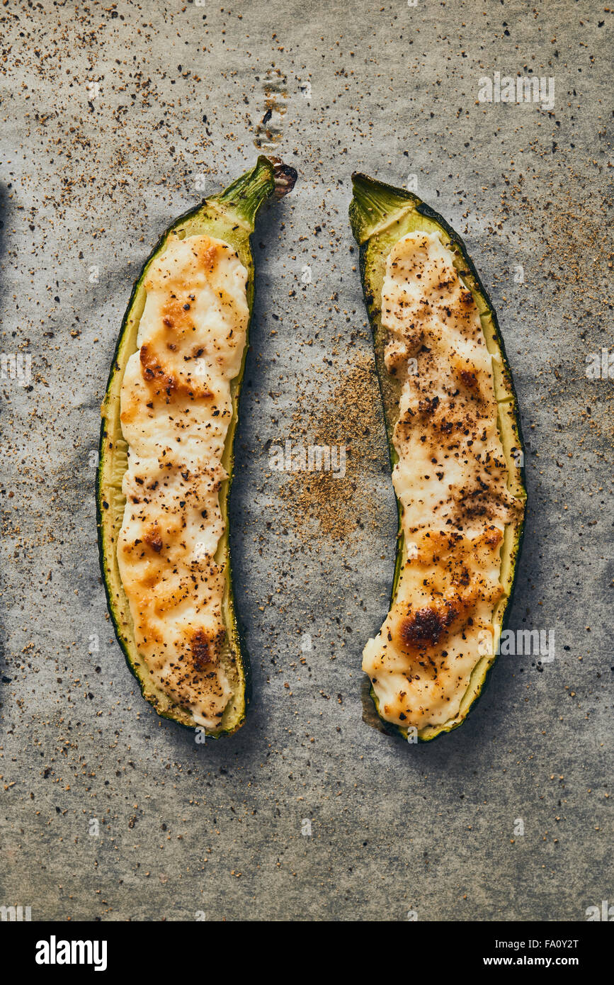 zucchini with ricotta cheese baked on baking sheet Stock Photo
