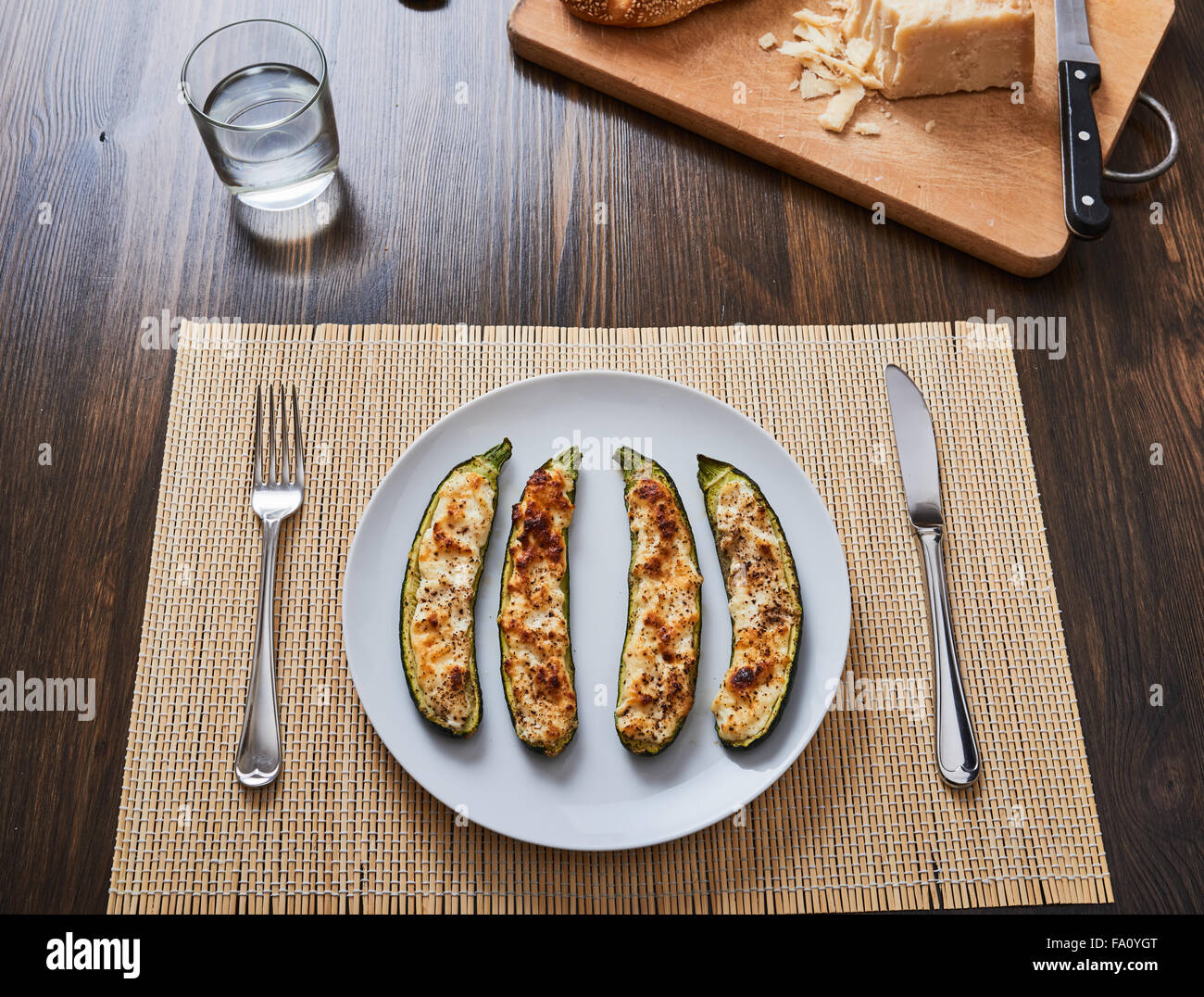 baked zucchini with ricotta cheese on white dish Stock Photo