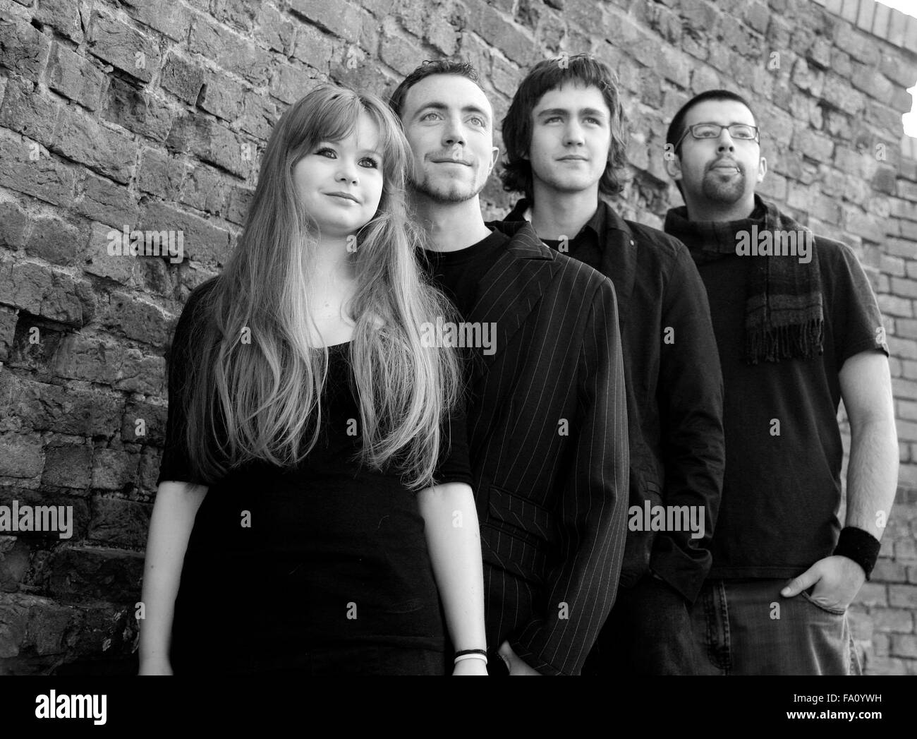Four young friends who were in a rock metal band together Stock Photo