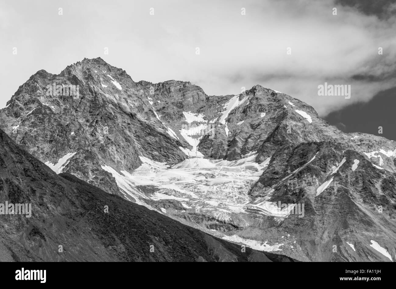 Dramatic Photo of Mountain Tops & Snow In Black & White Inside Glacier Bay National Park, Alaska Stock Photo