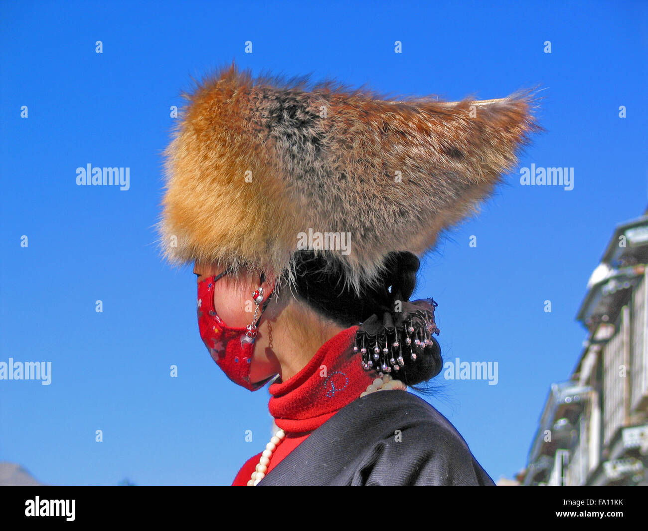 Tibetan woman wearing fur hat Stock Photo Alamy
