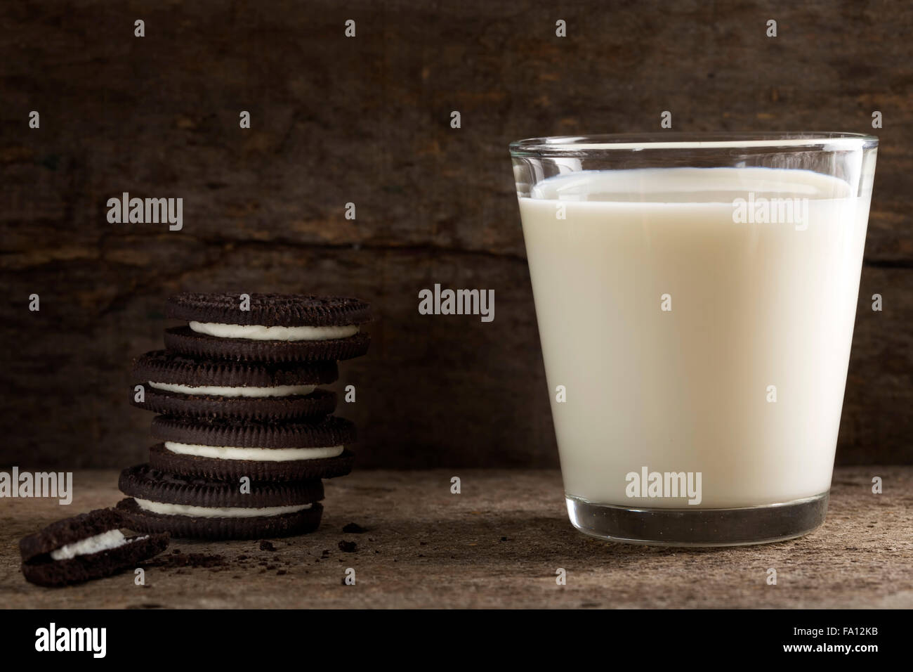 Cookies and milk over wood - a sweet dessert Stock Photo